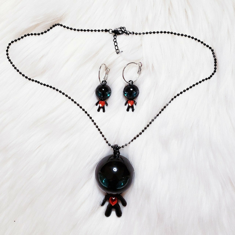 alien necklace and earrings set in black